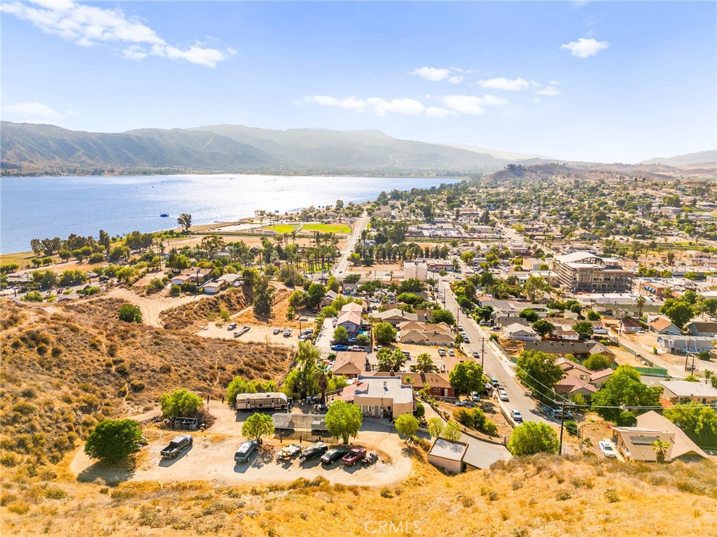 Investor’s Dream with Unmatched Lake Views and Development Potential!
Welcome to 250 E Prospect — a 2-bedroom, 1-bath home just a short walk from the heart of historic downtown Lake Elsinore. Perched on a hilltop with panoramic views of the lake and city, this property is truly a rare find. What makes this opportunity exceptional? It includes four additional parcels, totaling nearly 4 acres of land, all included in the price! Whether you're looking to build, expand, or create income-producing opportunities, the possibilities are endless. With its prime location, breathtaking scenery, and development potential, this is the kind of investment that doesn’t come around often. Whether you’re dreaming of a hillside retreat, vacation rentals, or a multi-unit venture—this one checks all the boxes.