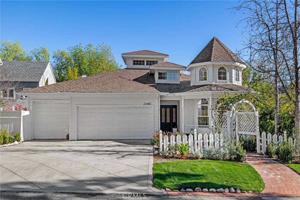 Welcome to 23482 Via Alondra, a stunning craftsman-stye home in the Coto's highly sought-after neighborhood, The Village. This 5 bed + bonus room home boasts a bright and spacious floor plan. On the entry level, you will find wood floors with shiplap vaulted ceilings throughout. The kitchen features white cabinetry, large island, farmhouse sink, and Viking 6-burner gas range stove with double oven. The family room showcases a beautiful floor-to-ceiling custom rock fireplace. Just off the family room is a large patio overlooking the one of a kind backyard with serene views. Also on the main floor is a formal dining room with a 2-sided brick fireplace with custom shelving, a guest suite with shaker cabinetry built-ins, and an attached 3-car garage fully remodeled with epoxy flooring and luxury cabinetry. Downstairs you will find an expansive bonus room, two bedrooms connected by a remodeled jack and jill bath, an additional bedroom with a remodeled en-suite, a half bath, laundry room and a Master Suite. The remodeled master bathroom features quartzite countertops and shaker cabinetry, a standalone tub, and a marble shower with mosaic flooring. The backyard showcases a rare fenced-in turf lawn along with a Michael Phelps Momentum D Swim Pool and Spa. Surrounded by a tree-lined greenbelt with a creek that runs behind it, this truly custom home provides a sense of privacy and tranquility. The newly installed solar system will take your electricity bills down to nearly nothing! Additional upgrades include new AC unit, chandeliers and light fixtures throughout, LED lighting and custom built-in cabinetry. Don't miss the opportunity to see what this beautiful home has to offer.