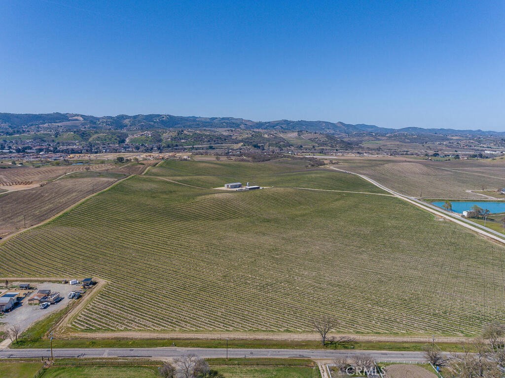 New Price! Vineyard or potential Hospitality development property (Winery, Hotel, golf course, RV park, etc.). A pristine 82.5 acre vineyard of Cabernet Sauvignon, planted in 2013; on approximately 92 acre parcel. An enviable property boasting pastoral and foothill panoramas, it is the perfect place to marry business and pleasure in a truly breathtaking location. Aside from an existing and great vineyard, the gently rolling land within the city limits offers potential developmental for hospitality uses including a hotel, golf course, winery and tasting room. With a temperate climate, this is prime location. One of only a few remaining AG zoned properties within the Paso Robles city limits, this prestigious vineyard guarantees personal and unique produce featuring the distinct aroma, taste and body of the particular region. It is incumbent upon anyone who is interested in buying the property with the intent of development to undertake due diligence by contacting the City of Paso Robles. Paso Robles was named one of “The 25 coolest towns in America” by travel website Matador Network. With spectacular surroundings, a convenient location and flexible usage, this is an incredible find. Check with City of Paso Robles on use.