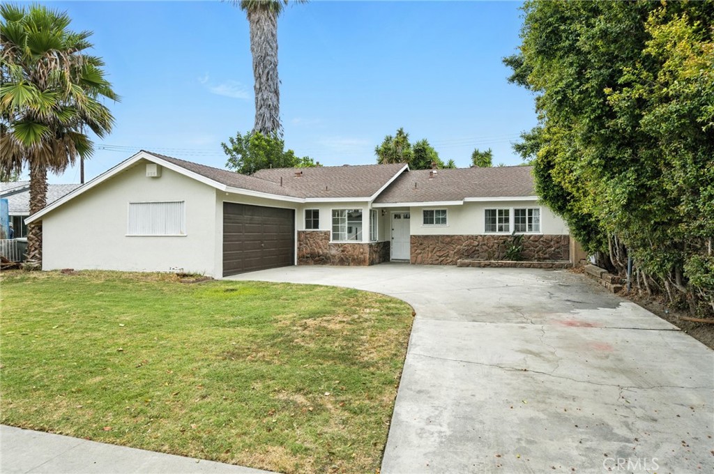 Welcome to 14192 Hope St — a beautifully maintained single-story home nestled in a serene Garden Grove neighborhood. This 4 bedroom, 2 bath residence offers 1,322 sq ft of comfortable living space on a spacious 7,200 sq ft lot with plenty of room to park an RV, additional vehicles or build a separate Accessory Dwelling Unit (ADU). Step inside to discover a recently updated kitchen featuring sleek quartz countertops, custom cabinetry, and a pantry perfect for culinary enthusiasts. The main living areas boast new luxury vinyl plank flooring, providing a modern and durable finish. The spacious living and dining areas create an inviting atmosphere for both relaxation and entertainment. Enjoy the expansive backyard, ideal for outdoor gatherings or simply unwinding under mature trees and garden areas.14192 Hope St is within walking distance to award winning schools, trendy dining spots, public transportation with easy access to major freeways. Don’t miss out on being in a prime location offering the perfect blend of comfort and convenience.