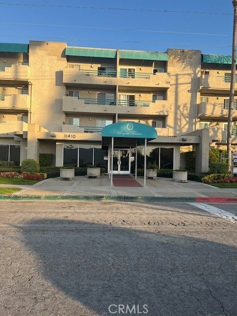 Photo of 11410 Dolan Ave unit 319 Ave, Downey, CA 90241 (MLS # DW26039421)