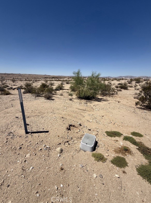 5 Acres with Water in Desirable Desert Heights!
Opportunity knocks in the highly sought-after Desert Heights neighborhood of 29 Palms! This expansive 5-acre parcel offers the perfect blend of seclusion and convenience—tucked away for privacy, yet just minutes from downtown shops, dining, and the entrance to Joshua Tree National Park.
Located right off the main road Lear Avenue, access is a breeze. Even better, a water meter is already installed and power is nearby, making this a developer’s dream or the ideal spot for your desert escape. Whether you're looking to build a custom home, vacation retreat, or investment property, this lot makes starting your project that much easier. Enjoy stunning desert vistas, wide-open skies, and peaceful surroundings—all from your own slice of the High Desert. Note: Lot lines in photos are approximate. Buyer to verify all utilities and zoning through personal due diligence.