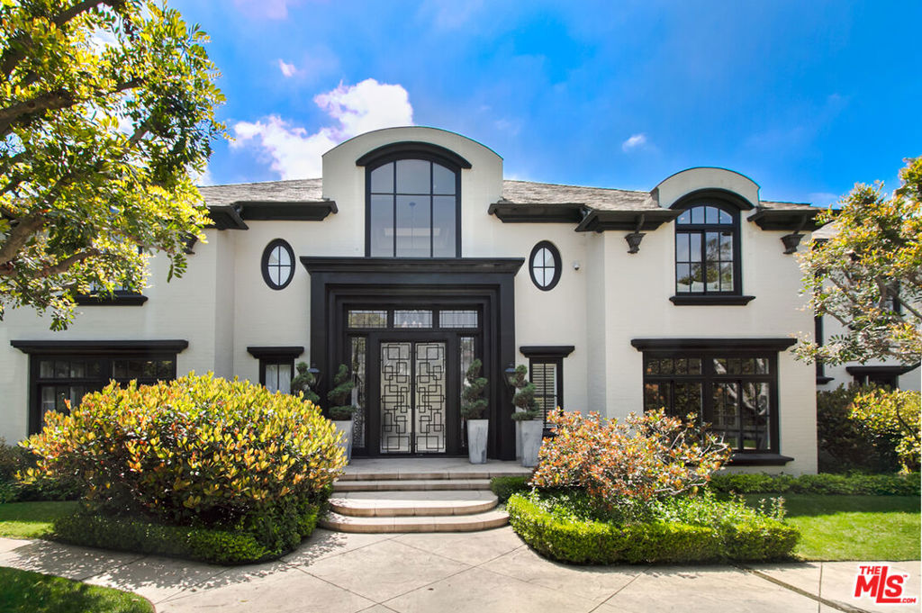 Fantastic Holmby Hills mansion spans over 10,600 SF on 1.2 acres offers unmatched luxury, privacy, and scale. Designed for grand living and entertaining! This private estate features: A dramatic living room with fireplace overlooks the front and side gardens. Enormous Family Room with coffered ceilings, marble fireplace, game area, and French doors opening to the lush backyard overlooking the pool. Formal dining room comfortably seats 20. Gourmets eat-in kitchen complimented by a separate breakfast room. Library/office with fireplace, full bath, and closet. Palatial primary suite boasts a sitting room, fireplace, and a spa-like bathroom the size of a bedroom, with generous walk-in closets. Each expansive en-suite children's bedroom includes its own sitting area. There is also a gym, kids' playroom, den, as well as two guest or staff suites. Outdoors, enjoy resort-style amenities including a north-south tennis court, pool, spa, and large grassy play areas and more. It is perfect for relaxation or recreation. You will love the stonework, cabinetry, doors, hardware, etc. this is truly top of the line! This gated estate offers the ultimate in privacy and prestige.