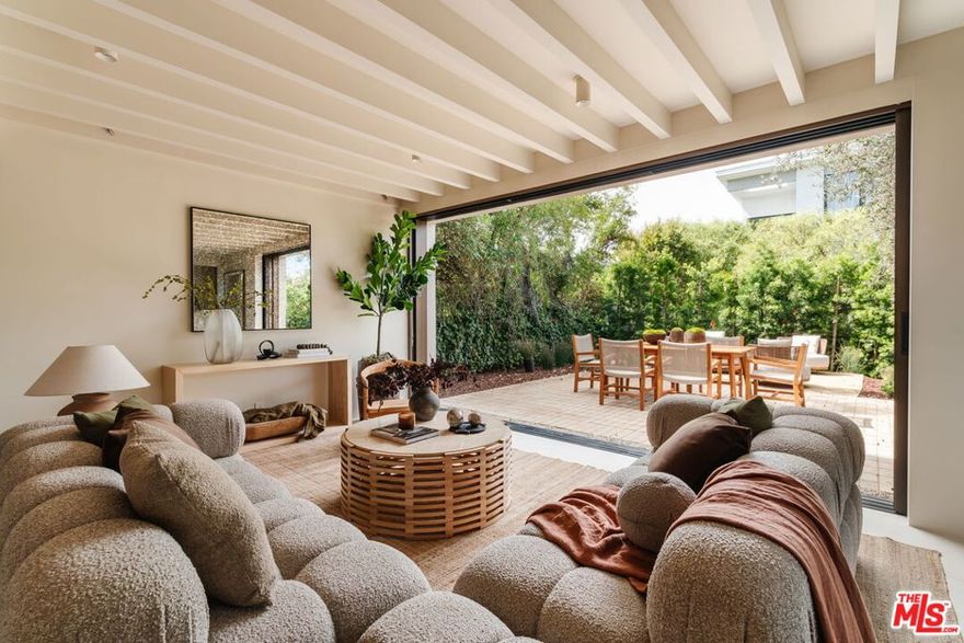 Nestled in Venice's charming walk streets, steps from lively Abbot Kinney and sunlit Pacific shores, this reimagined 2025 masterpiece spans over 3100 square feet, blending modern sophistication with warm organic elegance.Lush hedges embrace this serene sanctuary, featuring a 4-bedroom, 4-bathroom main house and a bright 1-bedroom, 1-bathroom guest unit perched above a spacious 2-car garage, seamlessly woven into nature.A majestic olive tree anchors a tranquil outdoor haven, perfect for relaxed gatherings and alfresco dining. Inside, the first floor opens with large-format tile radiating earthy luxury, where bronze anodized aluminum pocket sliders glide open to blend airy interiors with lush outdoor spaces, creating the quintessential Venice oasis. The chef's kitchen, crafted for culinary artistry, showcases white oak cabinetry, Taj Mahal quartzite countertops, luxurious appliances and Wolf stone cooktop and oven.Upstairs, white oak floors flow through three bedrooms, each exuding warmth, while the primary suite's Ocean Silver travertine shower evokes five-star hotel indulgence. This Venice gem, with its refined modernity and warm sophistication, redefines coastal elegance for intimate gatherings and grand celebrations.