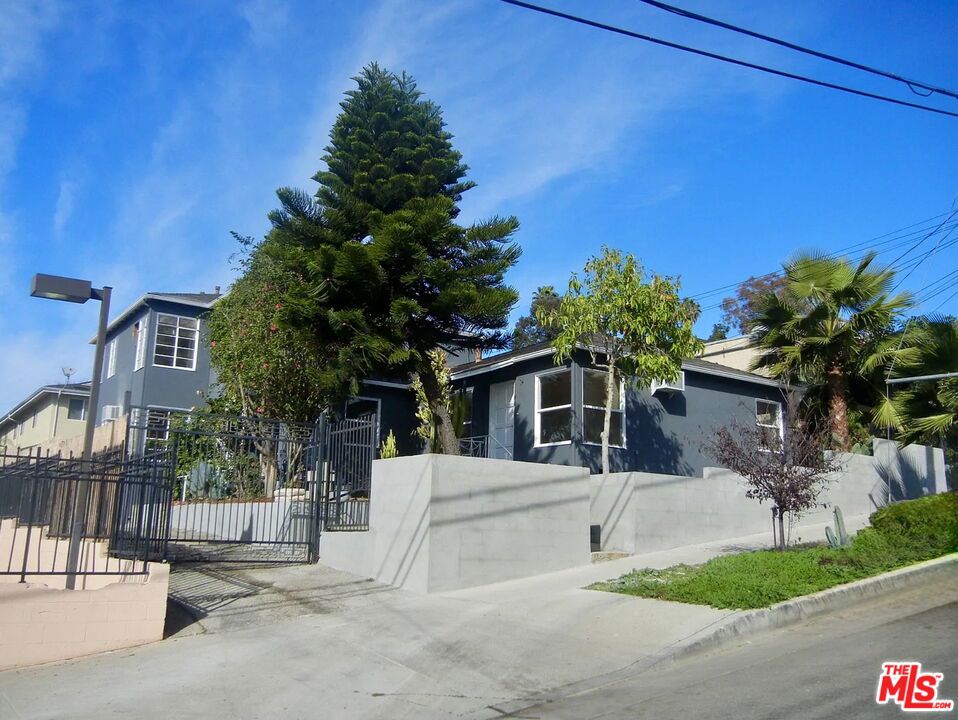 Welcome 1317 Douglas Street in Echo Park. This bright and updated upper unit offers stunning downtown and mountain views, ideally situated in Echo Park just off Sunset Boulevard near Dodger Stadium. Both bedrooms are generously sized with excellent closet space. Enjoy a spacious living room, a dedicated dining area, and a modern kitchen with ample counter space and storage.Located in a charming, gated triplex with only two other units, the property includes a shared outdoor BBQ area, one covered garage parking space and a shared laundry room. Pet-friendly and secure, you're just steps away from all of Echo Park's hottest spots, cafes, and nightlife.