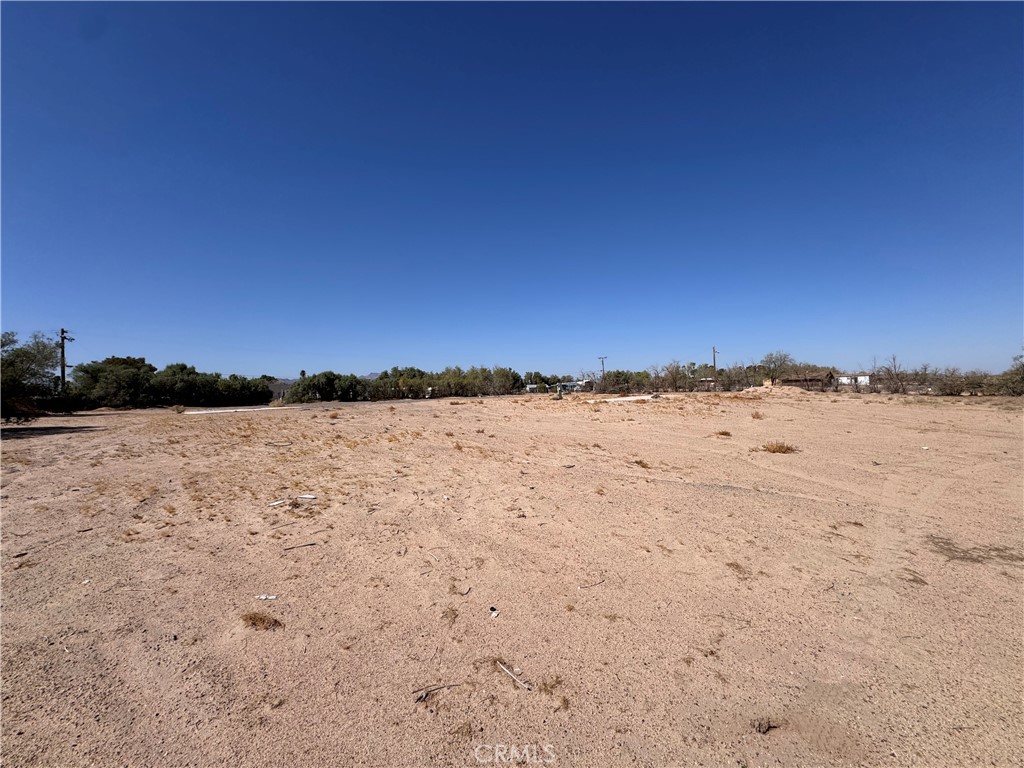What a great property for sale in Newberry Springs. Situated in the Lake Jodi Association. This property is a corner lot with the open desert just across the road. 2 acres of your own land. There are two concrete slabs on the property so there as well as water, and electricity of coarse. Enjoy the lake or the desert at Lake Jodi. It is comprised of 58 lots in a gated lake community that was developed in the 1970s. The lake is estimated to be 20-30 acres (exact size is unknown). Residents enjoy boating, waterskiing, fishing and swimming with their monthly assessments. Which cover water, lake and grounds maintenance.