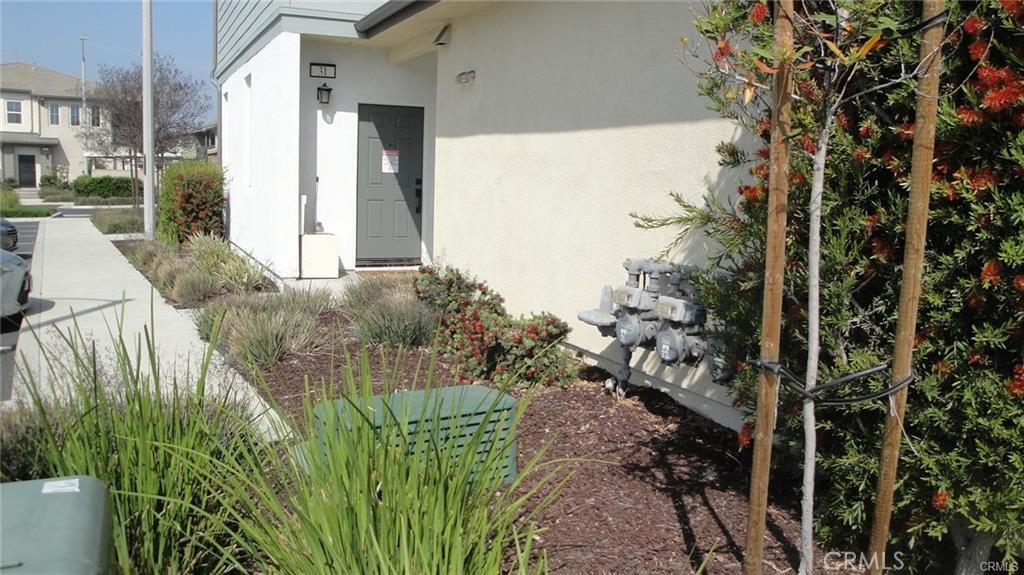 Built in 2019, this 3-bedroom, 2-bath home in Ontario offers 1,554 sq ft of modern living space with an open floor plan, versatile downstairs office, and attached 2-car garage. The gourmet kitchen features white soft-close cabinetry, tile backsplash, white granite countertops, and premium stainless steel KitchenAid appliances. The primary suite includes a walk-in closet, dual sinks, Italian tile, and a separate soaking tub and shower. Additional features include laminate wood flooring, tankless water heater, individual laundry room, and owned solar. Community amenities include a pool, BBQ area, and pocket park. Conveniently located near shopping, dining, and the 60 freeway.