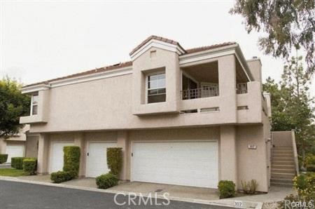Upper level condo located within a gated community. Quiet and cozy end unit with open view of William Mason Regional Park! 2 bedrooms, 2 bathrooms, 2 single car garages, vaulted high ceiling with wood flooring & newly painted. Walking distance to University of California of Irvine & shopping. Refrigerator, washer and dryer included.
