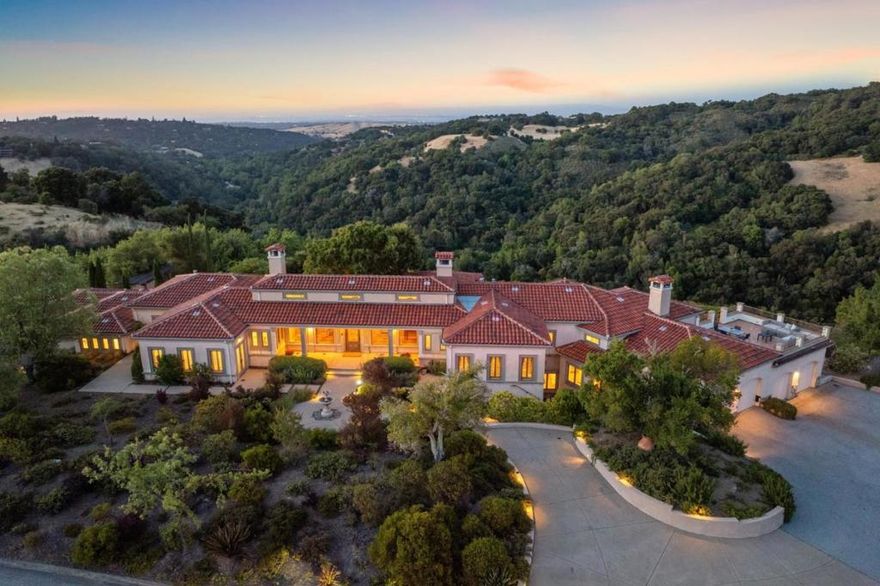 Perched on a knolltop within prestigious Blue Oaks, this luxurious estate epitomizes elegance and exclusivity. Set on 2.53 acres of naturally organic beauty, this residence offers unparalleled privacy and breathtaking views of the San Francisco Bay. A true sanctuary, the home seamlessly blends sophisticated design with the tranquility of its natural surroundings. The expansive living room, bathed in natural light from floor-to-ceiling windows, provides a stunning backdrop of the sweeping Bay views. The heart of the home is the gourmet kitchen, a culinary enthusiast's dream, that opens to a spacious family room, creating a true great room that is ideal for both everyday living and entertaining. Multiple adjacent terraces offer 360-degree views. Each of the 5 bedrooms is an en suite retreat. The primary suite offers a luxurious spa-like bath, walk-in closet, fireplace and picture windows that capture the serene vistas. In addition to an executive home office, the estate boasts a home gym, media/rec room, wine cellar, expansive swimming pool and 4-car garage. This estate in Blue Oaks is more than a home; it is a lifestyle. With its unmatched privacy, luxurious amenities and awe-inspiring views, it offers a unique opportunity to experience the pinnacle of Silicon Valley living.
