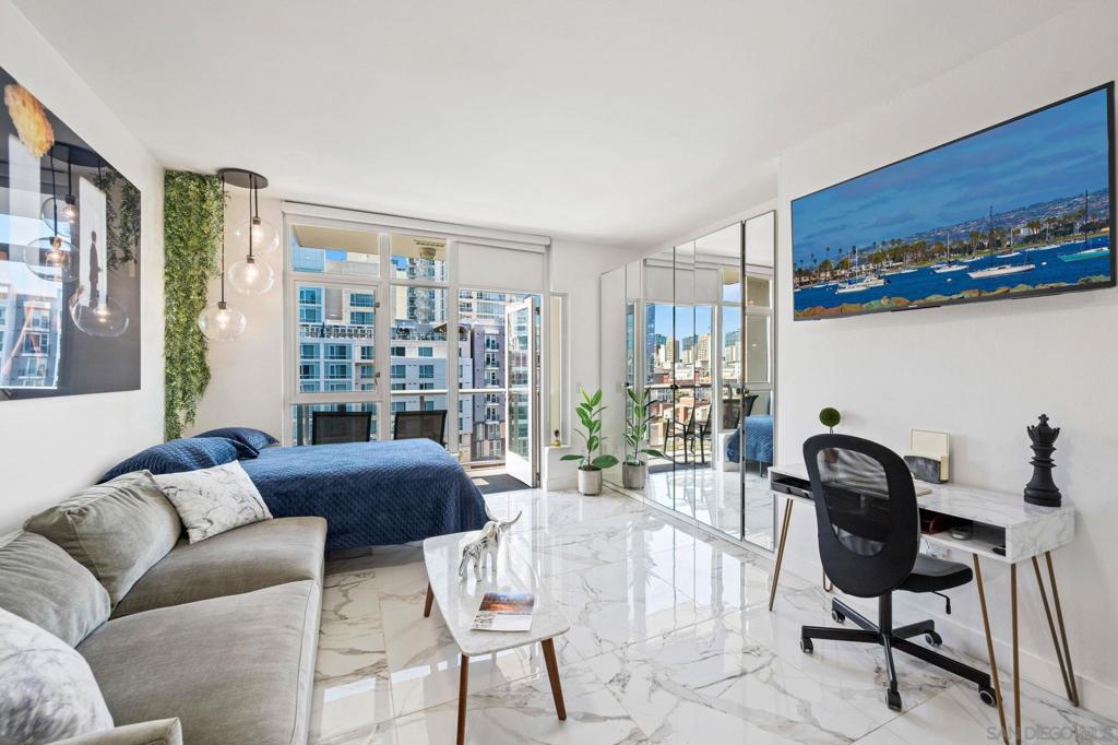 Newly renovated and upgraded East Village San Diego Studio next to Petco Park. Whether you're looking for your first home, a stylish vacation getaway, or a smart investment property, this Diamond Terrace Home has it all. The fully remodeled interior features large porcelain tile flooring throughout, modern light fixtures, and a beautifully updated bathroom with dual sinks and a step-in tile shower. The open-concept kitchen has been thoughtfully upgraded with new stainless steel appliances, sleek cabinetry, quartz countertops, and a contemporary tile backsplash. The unit comes with additional storage and 1 parking space. Located in the heart of East Village, Diamond Terrace places you just steps from San Diego’s iconic Petco Park. Residents enjoy stadium views from the building’s 14th-floor rooftop deck — the perfect spot for entertaining or socializing with neighbors. Diamond Terrace also offers a variety of resident amenities, including a rooftop BBQ area, a stylish community room, and a fully equipped fitness center. With its prime location, you're only moments from East Village’s trendiest restaurants, bars, boutique shops, and entertainment — offering an unbeatable urban lifestyle in one of Downtown San Diego’s most dynamic neighborhoods.