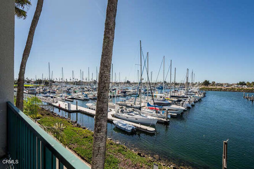 Spectacular Waterfront Living at an Unbeatable Value.   A must-see coastal gem! Enjoy one of the most breathtaking water views in the Hollywood Beach community--at one of the lowest prices in the area. This rare two-bedroom end unit is ideally positioned closest to the water, offering unparalleled privacy and a spacious large patio that feels like your on  the bow of your own yacht.   Watch the boats glide by and soak in world-class sunsets over the Channel Islands  from every room.Inside, you'll find a beautifully upgraded, turnkey home featuring rich wood cabinetry, granite countertops, elegant stone tile floors, custom-tiled step-in showers, and designer lighting throughout. The inviting living area includes a handsome wine cooler and butler's pantry, plus a convenient bar seating pass-through to the kitchen,  perfect for entertaining.Nestled in the heart of Ventura County's Channel Islands Harbor, this resort-style community offers membership to a Private Marina Club with amenities that include a heated waterside pool, spa, gym, saunas, tennis and pickleball courts, a luxurious clubhouse, and ample guest parking.Just a short stroll away, you'll find almost deserted soft sand, dog-friendly beaches, world-class surfing, and miles of scenic walking or biking paths.   Enjoy a vibrant coastal lifestyle with weekly farmers markets, live concerts, seasonal festivals, and an array of dining, sport fishing, and boating adventures--including excursions to the Channel Islands National Park, just 11 miles offshore.Perfect as a vacation retreat or full-time residence, this fully furnished home is ready for you to move in and start living the Coastal dream. Plus, exciting new waterfront development--including a luxury hotel, waterfront restaurant, and a new yacht marina--is underway right next door, adding even more value to this exceptional location.  Channel Islands Harbor is located on the Coast halfway between Malibu and Santa Barbara - come see why Ventura County was voted 'The Best Pace to Live in America.'