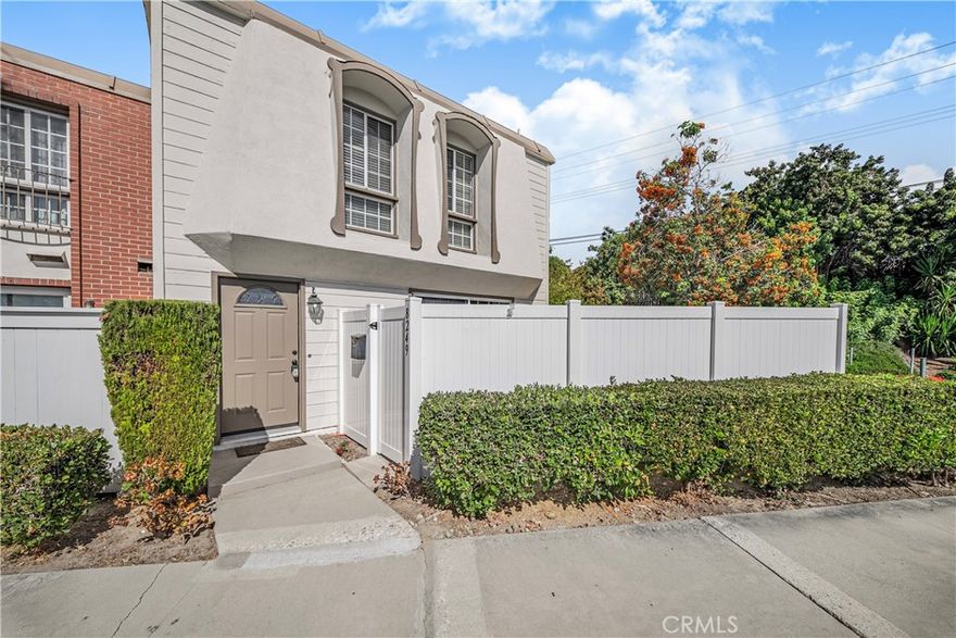 Nestled in the sought-after Highland Greens community of North Buena Park, this charming end-unit, townhome-style single-family residence offers 3 bedrooms and 2.5 baths, with no one above or below and only one shared wall for added privacy. The light-filled, open-concept layout features a spacious living room with built-in shelving and double sliding doors opening to a private front patio—perfect for relaxing or hosting guests. The dining area flows seamlessly to an enclosed rear patio, ideal for al fresco dining or gardening, with direct access to a 2-car garage with rear entry. The modern kitchen boasts granite countertops, a stylish tile backsplash, and stainless steel appliances. Fresh interior paint and an indoor laundry area with included washer and dryer add convenience. Located in the acclaimed Sunny Hills High School district, this home is steps from Beatty Middle and Emery Elementary schools, Friendship Park, and vibrant dining and shopping, including Baekjeong Korean BBQ, H-Mart, Zion Market, and Hannam Chain. Enjoy community amenities like a sparkling pool, playgrounds, and lush greenbelts. This home blends comfort, prime location, and modern convenience in the heart of Buena Park.