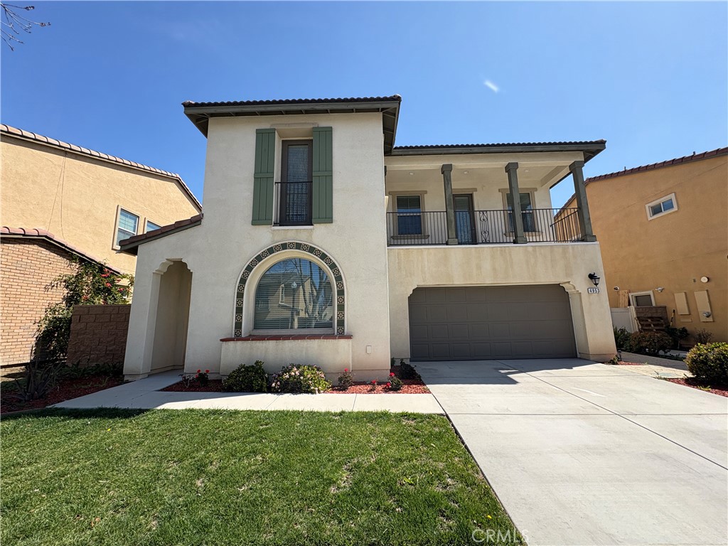 Nestled in the vibrant Master Planned Community of Park Place in Ontario Ranch, this modern home offers both comfort and convenience. This residence welcomes you with a charming courtyard, perfect for unwinding in the fresh air. Inside, a cozy first-floor bedroom with a full private bathroom is ideal for guests. The spacious living room provides a great space for gatherings, while the open kitchen features a stunning granite island, full backsplash, and a walk-in pantry for effortless storage. Upstairs, a stylish loft and balcony offer a relaxing retreat, and the master suite boasts a generous walk-in closet, soaking tub, separate shower, and double vanities. Two additional bedrooms share a well-appointed full bathroom. Community amenities include a clubhouse, swimming pool, spa, BBQ areas, and a dog park, ensuring entertainment for all. With easy access to shopping, dining, and major freeways, this home offers the perfect blend of luxury and convenience for any lifestyle.
