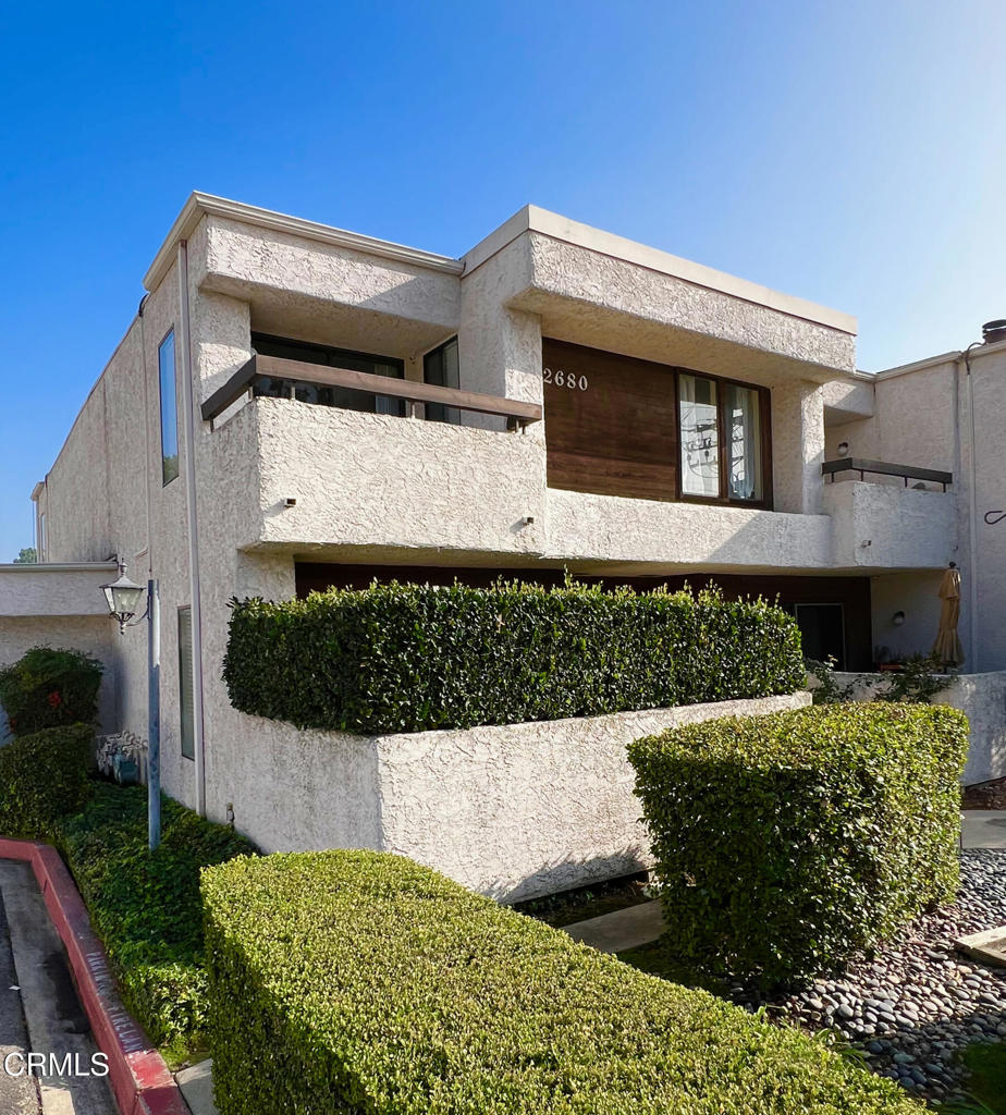 Spacious and light-filled end-unit townhouse-style condo for rent in Altadena located in the gated Pinewood Condos complex, which offers 822 square feet of living space with two private outdoor areas, a decorative fireplace, with mountain and treetop views. This freshly painted and cleaned home features an updated kitchen and bathroom, dining area niche, and in-unit laundry with washer and dryer included. The kitchen is equipped with a new dishwasher, four-burner gas stove, and refrigerator for added convenience. A newly carpeted staircase leads to a large upstairs bedroom with a loft-style feel and additional space ideal for a work from home office, workout area, or creative studio. Residents enjoy community amenities including a sparkling swimming pool, covered carport parking for 1 car, and guest parking. Situated just minutes from Pasadena and near El Patron restaurant, Grocery Outlet, and the Altadena Public Library, this Altadena rental is also close to newly reopened Farnsworth Park, and it's commonly scheduled activities such as community musical events. With a combination of comfort, style, and a good location, this move-in-ready condo for lease in a rarely available gated complex offers exceptional value and convenience.