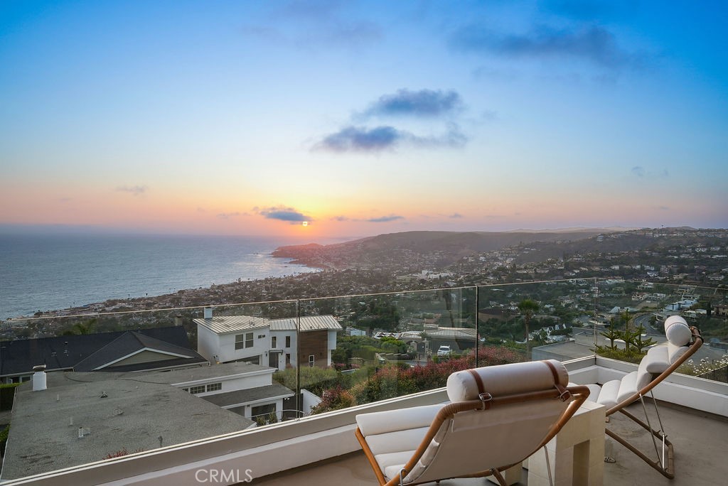 Prepare to be captivated by show-stopping ocean views that will leave you breathless. From crashing waves and golden Catalina sunsets to twinkling city lights and sweeping canyon vistas, every angle of this home captures the magic of Laguna Beach living. Step inside and enjoy a sun-drenched, open-concept living area with floor-to-ceiling glass sliders opening to a wide ocean-view balcony. This indoor-outdoor flow defines this incredible home, with three bedrooms and three-and-a-half baths, a sunken and spacious private front courtyard with a water feature, and a lushly-landscaped backyard that offers complete privacy. This space truly feels like your own private retreat while offering stunning scenery and unlimited entertaining potential. Perfectly positioned on a cul de sac in Arch Beach Heights, the property is just a mile from the beach and only a half mile from Moulton Meadows Park with its tennis and basketball courts, playgrounds, dog park, and miles of scenic trails for hiking and biking. Here, you're surrounded by the very best of this coveted coastal community. A short golf cart ride or free trolley ride north takes you downtown, while a short drive south leads to the world-famous Montage Resort less than 2 miles away. This property is truly a rare gem in one of Laguna’s most desirable neighborhoods. It's not just a home — it’s a front-row seat to the extraordinary. Schedule your private showing today.
