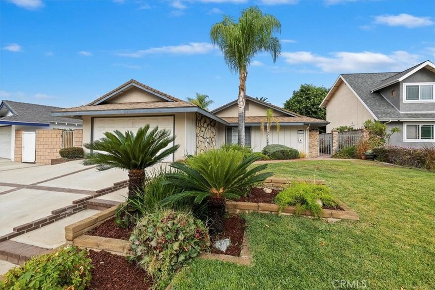 A well maintained home nestled on a cul-de-sac.. Charming curb appeal with a brick ribboned driveway, terraced planter, mature palm trees, and brick walkway leading to a private gated main entry..  The tranquil, brick, courtyard like, entry brings you to an attractive set of double doors.. Quaint rear grounds are highlighted with a large brick patio, planters, vine covered walls and an additonal isolated backyard section thru a hedge archway.. Spic and span clean interior with fresh paint, new carpeting, and glossy laminate wood design flooring.. Lots of natural light flows in from skylights, large dual pane windows, sliding doors, and french doors.. Comfortable sized living room overlooks a delightful atrium like area and has floor to ceiling fireplace.. An impressive kitchen has tile counter tops, garden window, breakfast bar, good looking cabinets with roll out drawers, and dining area.. Master bedroom has mirrored closet doors, celing fan, and private bath with french doors.. Family room off the kitchen overlooks the back yard with large sliding door. A very pleasant home with an open floorplan and nurmerous upgrades through the years including central air & heat, dual pane windows, and PBX plumbing.. Extra perks are it's located in the Charter Oak School District with California Distinguished schools, close to parks, churchs, neighbohoood shopping centers, wilderness trails & walkways, and community colleges.. A great opportunity for some lucky family!!