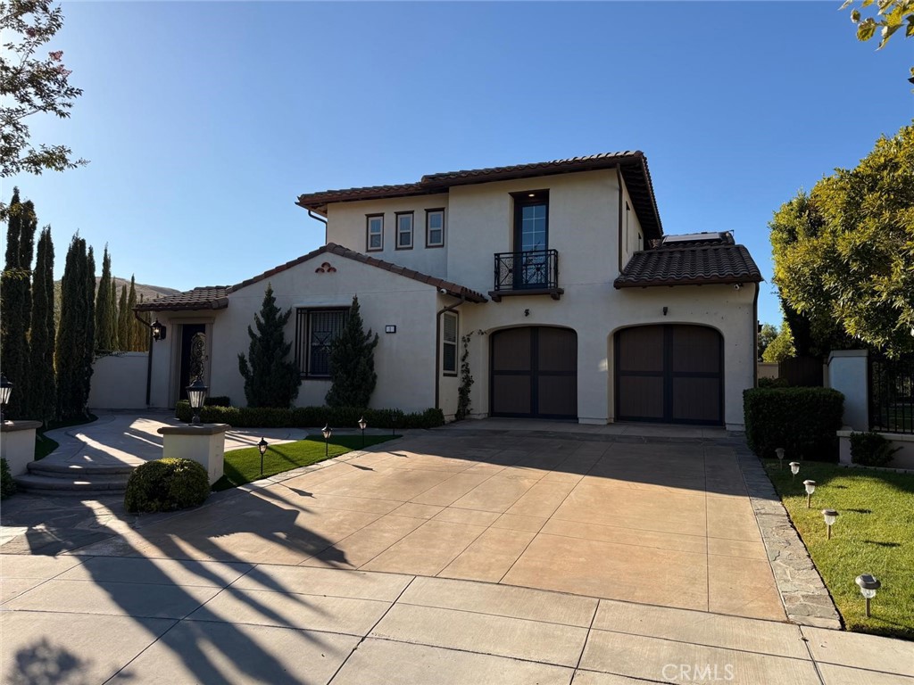 Motivated sellers - Nestled at the end of a quiet cul-de-sac within the prestigious guard-gated community of Covenant Hills, this Spanish-style residence blends timeless architecture with refined modern living. Situated on an expansive wraparound lot that backs to open space, the home showcases panoramic views and a peaceful, private setting.
A formal entry leads to an open, light-filled layout featuring rich hardwood floors, custom stone finishes, and detailed millwork throughout. French doors open to the exterior from multiple rooms, enhancing the seamless indoor-outdoor flow that makes this home perfect for both everyday living and entertaining.
The main level includes a luxurious primary suite with a spa-like bathroom, soaking tub, dual vanities, and a large walk-in closet. A secondary ensuite bedroom on the main level offers added flexibility. Upstairs, a spacious bonus room connects two additional bedrooms, offering privacy and versatility.
The chef’s kitchen boasts a generous center island, high-end appliances, and abundant storage, flowing effortlessly into the inviting family room with custom built-ins and a fireplace.
The beautifully landscaped backyard is a true retreat, complete with a built-in BBQ island, cozy fireplace, in-ground spa, and plenty of space for relaxing or gathering.
Enjoy access to Ladera Ranch’s renowned amenities including community pools, tennis courts, walking trails, skate and splash parks, playgrounds, and nearby top-rated schools. Bring your best to own this beautiful estate NOW