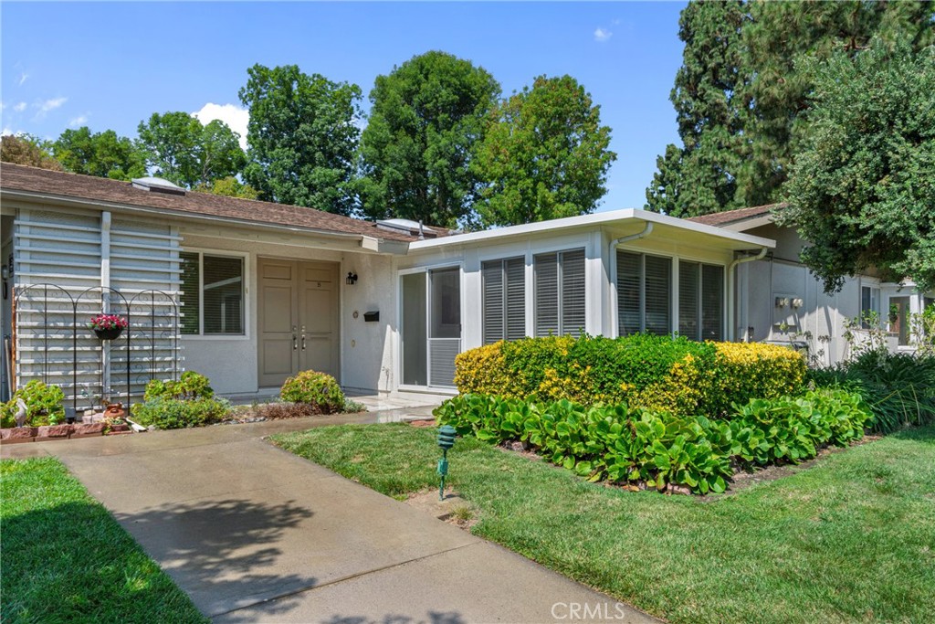 Now Leasing - Stunning Granada Model in Laguna Woods Village. This is your opportunity to lease one of the most popular single-level floor plans in the 55+ resort community! This upgraded 2 bedroom and 2 bath unit is located on a quiet street and offers about 1,050 sq. ft. of interior living space, including in-unit full-size washer/dryer, and central HVAC.
The home features an open kitchen with custom cabinetry, granite countertops, upgraded appliances, and a spacious dining area. Also the unit includes wood-style laminate flooring, dual-pane windows, and two bathrooms with walk-in showers and custom vanities.
The front patio has been enclosed to create a climate-controlled den or craft room, adding functional living space and flexibility.
Enjoy all that Laguna Woods has to offer, including:7 clubhouses, 5 swimming pools, 3 fitness centers, 36 holes of golf, 250+ clubs and activities