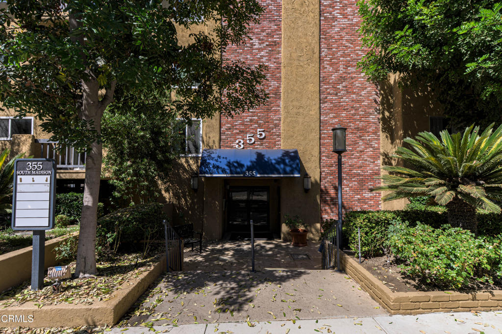 Discover this bright and desirable top-floor condo, ideally located just moments from Old Town Pasadena and South Lake shopping district. Designed for both comfort and functionality, this residence features an ideal split bedroom floorplan with two private primary suites situated on opposite sides of the unit--each offering en-suite bathrooms and multiple closets for abundant storage. The interior showcases fresh paint and stylish wood like laminate flooring throughout, creating a modern and inviting atmosphere. The kitchen seamlessly connects to the dining and living areas and is equipped with a new microwave and dishwasher, plus a range and refrigerator for effortless entertaining. A central decorative fireplace anchors the living room, which opens to a private balcony with courtyard and treetop views. Community amenities elevate the urban lifestyle with a fitness gym, recreation/lounge room, and BBQ/court yard area with lounge seating. The sparkling pool is currently undergoing upgrades to enhance your future enjoyment. Two dedicated subterranean parking spaces complete this exceptional offering. With California Institute of Technology, The Huntington Library and the Rose Bowl just minutes away, this residence delivers the perfect blend of comfort, convenience, and prime Pasadena living.