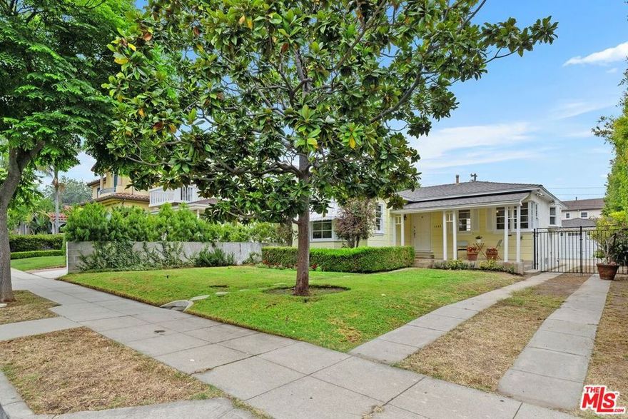 This charming 2-bedroom, 1-bathroom home with a den is available for the first time in years. One of the original homes on the street, it retains its charm with authentic period details from the 1930s, including arched doorways, cutout cabinetry, and a lovely bay window. The living room features a tiled fireplace that adds to the home's character. The tastefully updated kitchen boasts white cabinetry, Caesar stone countertops, and a large farmhouse sink. The den, which overlooks the yard, is ideal for use as an office. You can greet your neighbors from the delightful front porch and enjoy a spacious, flat backyard with mature fruit trees, as well as a 2-car garage. Fantastic neighborhood in a prime location, just blocks from Franklin Elementary School, Douglas Park, and a short stroll to Whole Foods and nearby cafes. Don't miss the opportunity to embrace the classic California lifestyle right here in the heart of Santa Monica.