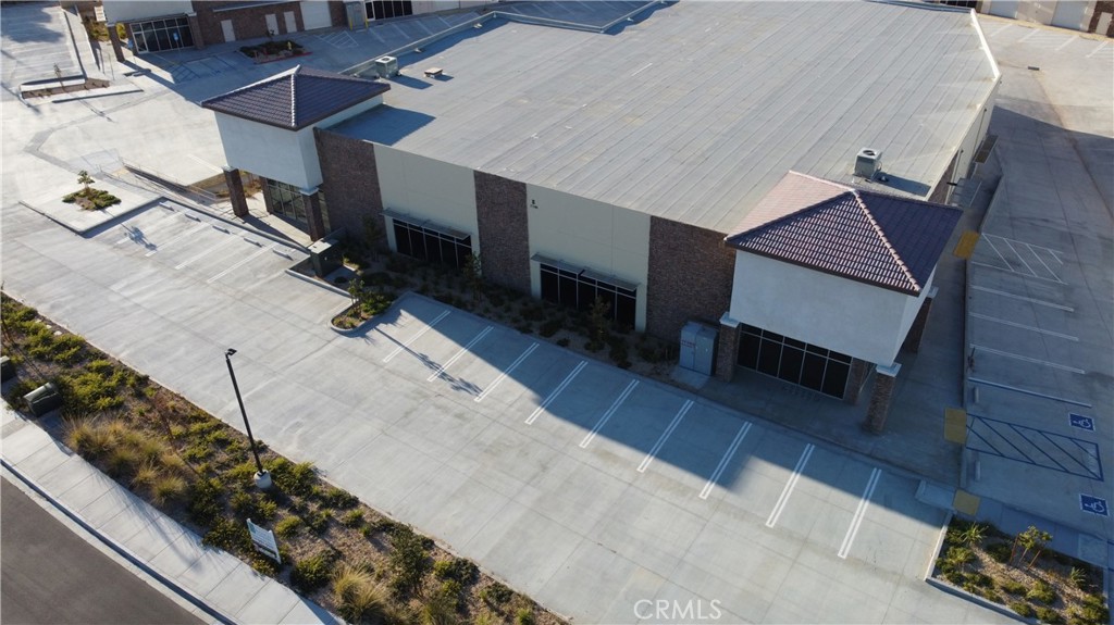 Building E is ±17,748 Sq. Ft. and includes one (1) ground level roll up door and two (2) built out offices at each end of the building. Potential to divide the building in half.
