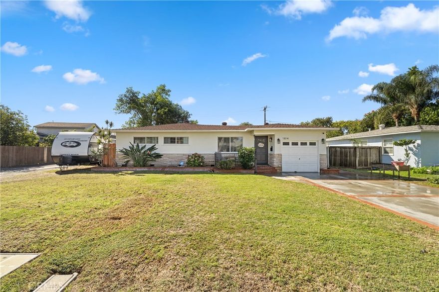 Welcome to this gorgeous neighborhood! You don’t want to miss this beautifully and professionally remodeled home, now on the market. Step inside to discover a bright and welcoming interior filled with natural light, newer flooring, recently upgraded paint, and stylish finishes throughout, making this home truly move-in ready. The kitchen is a chef’s dream, featuring newer shaker-style cabinetry with ample storage, sleek quartz countertops, and a tasteful splash of color that makes meal prep and entertaining a delight. The bathroom has been remodeled recently with upgraded fixtures and finishes.
This charming home offers three bedrooms and one bathroom, and lots of open living space.  Step outside to a spacious, flat backyard with a fence and covered patio, creating the ideal setting for gatherings or quiet evenings outdoors. The large lot with alley access provides an amazing opportunity to potentially build an Accessory Dwelling Unit (ADU), and there is ample space on the side for RV parking. Located within the highly sought-after Sunny Hills High School and Parks Junior High boundaries, this home offers both convenience and excellent educational opportunities.
A newer electrical panel provides peace of mind and years of worry-free living. Don’t miss this incredible opportunity to own a thoughtfully updated home in a desirable area with endless potential.