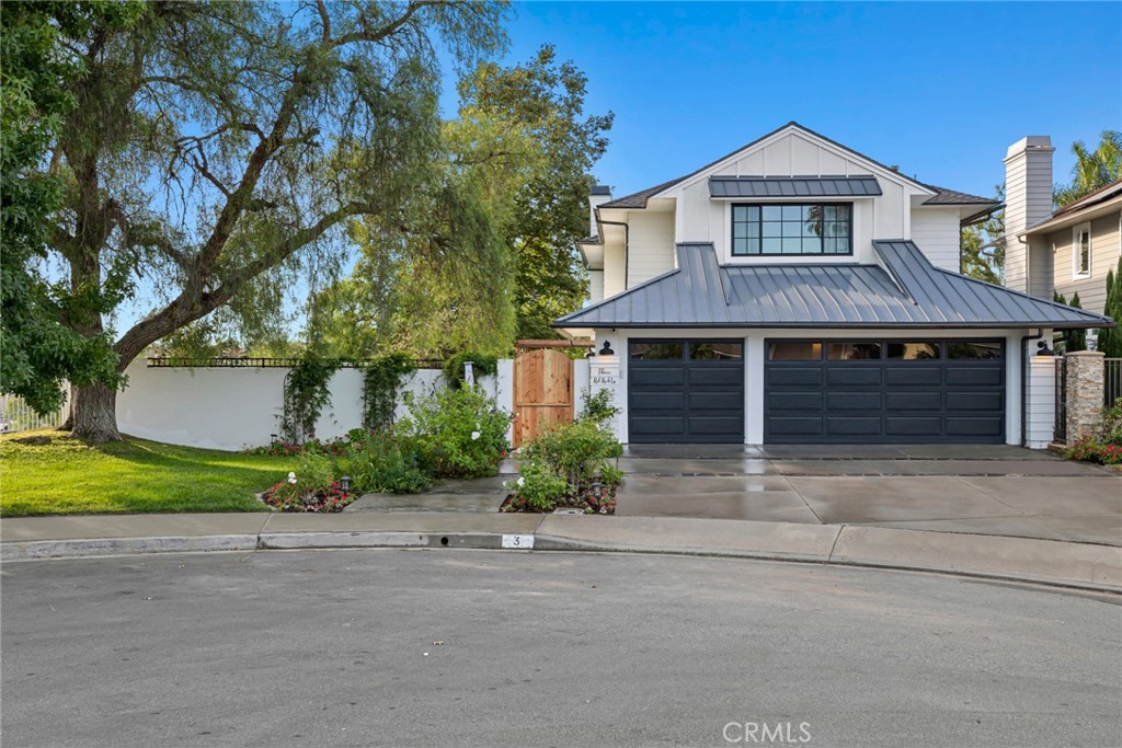 Welcome to the beautiful and highly sought-after Summerwalk community! This stunning end-of-cul-de-sac home has one of the best and largest lots in the entire community, offering four total bedrooms, including one on the main floor, three bathrooms, an additional upstairs enclosed loft, and an office space- providing plenty of room for family and guests. When you pull up to this breathtaking, newly updated home, you are greeted by a large front yard, spacious three-car garage (with a tesla charger installed), and a new, stylish metal standing seam roof. Once you step inside the Dutch door gate, you will find yourself in the expansive courtyard leading to the natural wood Dutch front door. Inside are brand new wide plank vinyl floors, which carry you right into the formal dining and family room, equipped with brand new, gorgeous French doors leading out to a covered patio. Next, you will find yourself in the open concept kitchen and living room area. The completely customized kitchen has been beautifully upgraded with top-of-the-line appliances, such as a Bosch oven, gorgeous Taj Mahal countertops, and timeless maplewood cabinets. Outside the kitchen is the extremely large backyard, with a cozy California room perfect for watching a movie on a summer night or enjoying a cup of tea in the morning. The main floor bedroom and bathroom have also been newly updated, perfect for a guest or in-laws. Heading upstairs, you will find the primary suite with a walk-in closet and a perfectly updated spa-inspired primary bathroom- brand new tile flooring, shower, standalone bathtub, and vanity, two additional bedrooms, a full bathroom, a loft, an office nook, and. With biking and hiking trails to Salt Creek Beach, great schools, and close proximity to shopping, the harbor, and the beach, there is nothing not to love about this perfect Laguna Niguel home.