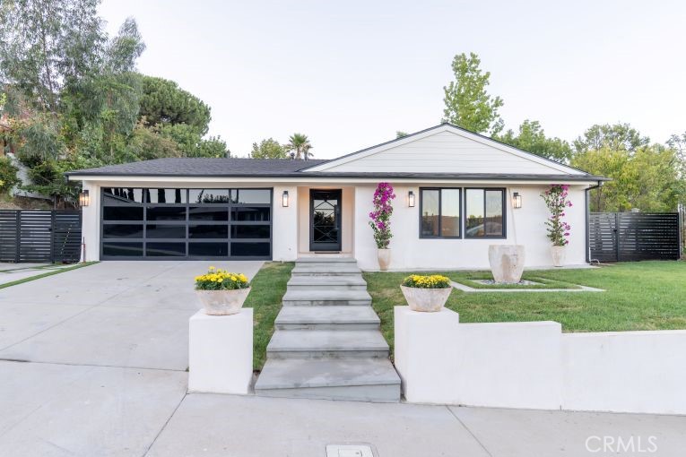 Welcome to this beautiful single - story Granada Hills retreat, offering the perfect blend of comfort, charm and convenience. Situated on a spacious 10,694 sq ft lot, this 4-bedroom, 3-bathroom home spans over 2,097 sq ft of living space with a bright and functional layout ideal for both everyday living and entertaining.
Step inside to find an inviting living room with a cozy fireplace, seamlessly connecting to a dining area and open kitchen that's ready for your culinary creations. Large windows fill the home with natural light, while sliding glass doors open to a private backyard oasis- perfect for large gatherings, gardening, or simply enjoying the California sunshine.
The primary suite offers a peaceful retreat with its own ensuite bathroom, while the additional bedrooms provide flexibility for family, guests, or a home office. An attached garage adds convenience and storage.
Nestled on a quiet street in the heart of Granada Hills, this property is close to top-rated schools, shopping, dining, and easy freeway access. Weather you are looking to settle into a forever home or invest in a property with incredible ADU potential, this residence is a rare find in a prime neighborhood.
Come and explore more about this piece of gem!