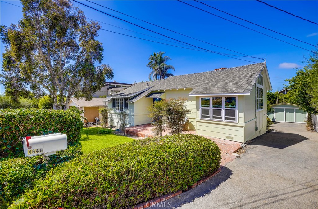 Charming Woods Cove Duplex just steps from the beach! 464 Agate St shows two updated coastal cottages on a larger-than-average lot in one of Laguna Beach’s most desirable neighborhoods. Unit A (front cottage) features 1 bedroom, 1 bathroom, approx. 800 sq. ft. Unit B (rear cottage) includes 2 bedrooms, 2 bathrooms, approx. 850 sq. ft., with custom cabinetry. Both homes have been meticulously maintained with updated kitchens and bathrooms, newer windows, high ceilings in the living rooms, and abundant natural light. Recent improvements include new roofs on both homes last year and a newer fireplace facad. Additional highlights include in-unit laundry for each cottage, ample parking, and well-maintained interiors. Enjoy the convenience of being within walking distance to multiple beaches and just moments from local shops, dining, and galleries along Coast Highway. This versatile property is ideal as a full-time residence, investment opportunity, or a combination of both.