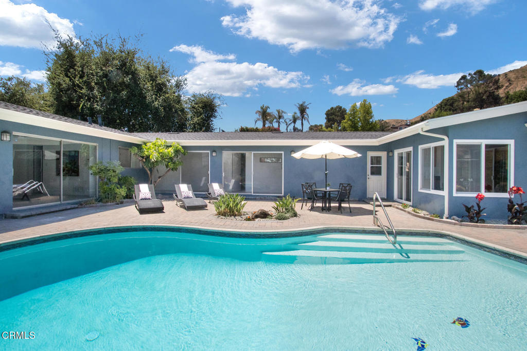 Beautiful mountain views! This lovingly maintained home has had many modern upgrades, yet still exudes that highly sought after mid-century vibe. With two primary suites, and 3 additional bedrooms, all on one floor, you'll have many options for use. The sprawling wrap-around design, highlights the recently refinished sparkling pool and patio, your own private oasis. A short distance to hiking trails, with a view of legendary Gravity Hill, and with the vibrant South Lake Shopping District and Old Town Pasadena a short drive away, this property truly is a gem. Don't miss this wonderful opportunity to own a piece of Altadena's history, and be a part of its bright future.