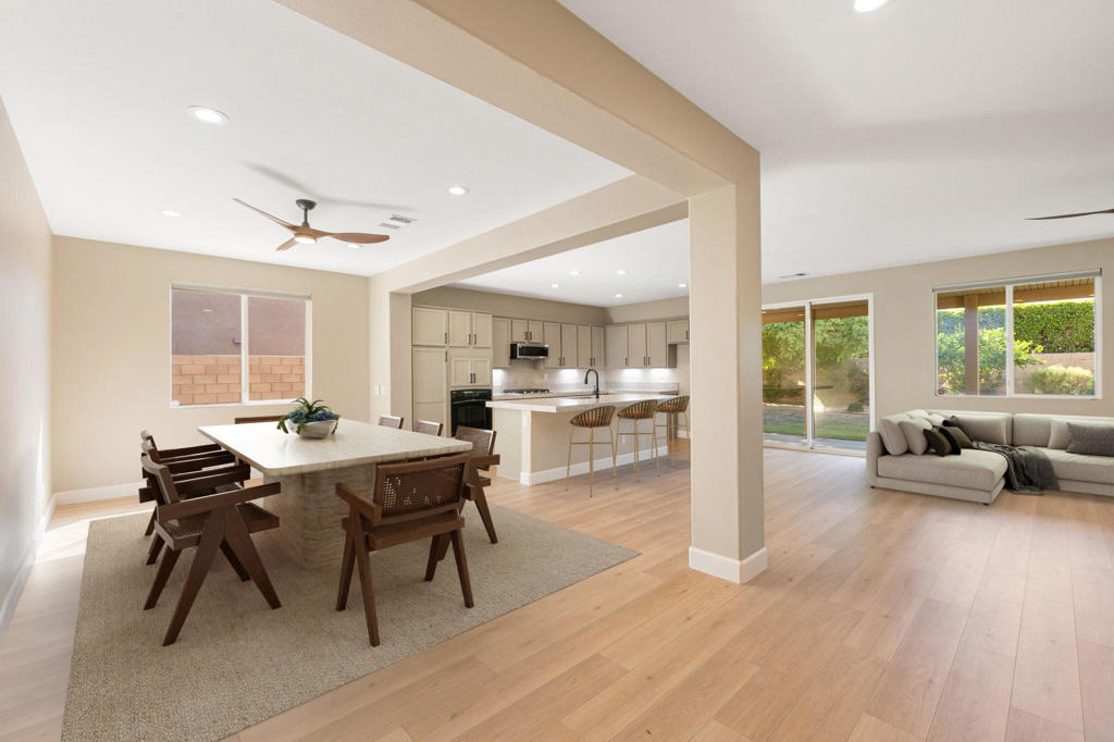 Discover this beautifully upgraded 4-bedroom, 3-bathroom home with a flexible bonus room, located in the highly sought-after Paradiso community in Indio. Offering 2,439 sq ft of refined living space on an oversized 8,700+ sq ft lot, this move-in-ready residence perfectly blends style, comfort, and functionality. This open-concept home features a stunning redesigned fireplace with imported Italian tile, brand new flooring, and a well-appointed kitchen with granite countertops, refinished cabinets, new stainless steel appliances, and a spacious island--ideal for entertaining or everyday living. Thoughtful updates throughout include fresh interior paint, brand new carpeting upstairs and on the staircase, updated ceiling fans and faucets, and a brand-new shower enclosure in the primary suite. Tile flooring runs through the common areas, and a dedicated upstairs laundry room adds convenience. The primary suite offers a serene retreat with a soaking tub, separate shower, and dual vanities, while three additional bedrooms and a flexible downstairs bonus room provide space for family, guests, or a home office. Step outside to enjoy the beautifully landscaped backyard with a covered patio, perfect for relaxing or entertaining. Additional features include a 3-car garage (2-car plus tandem) and low HOA dues. Nestled in a quiet, well-maintained neighborhood close to shopping, dining, and excellent schools, this home is a rare opportunity to own in one of Indio's most desirable communities. (Some photos are virtually staged).
