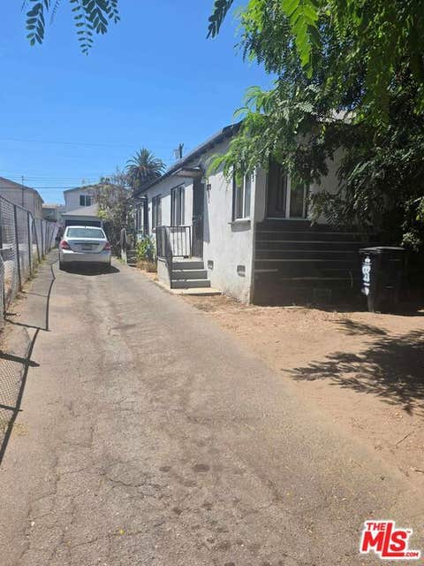 Photo of 8719 Orchard Avenue, Los Angeles, CA 90044 (MLS # 26867757)