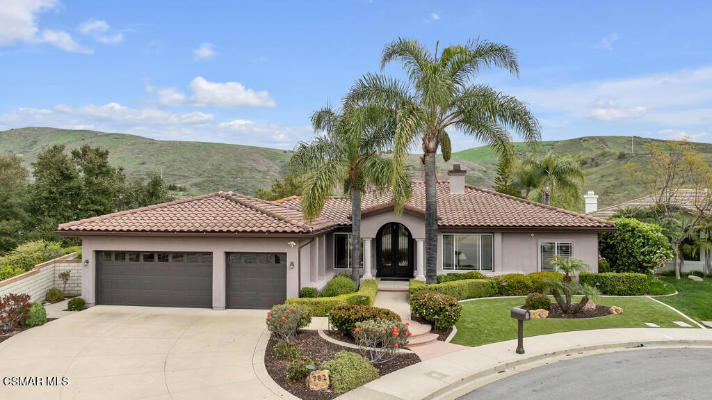 Perched up high in the prestigious and sought-after Emerson Estates, this exceptional single-story home offers breathtaking mountain views, ultimate privacy, and exquisite craftsmanship and design throughout. This 4-bedroom, 3-bathroom residence has been meticulously maintained by its original owner and is now available for the first time, presenting a truly rare opportunity. Step through the custom iron front door into the grand entryway, where the formal living room welcomes you with a timeless fireplace and an inviting ambiance. Just beyond, the dining room--perfect for hosting--sits conveniently off the chef's kitchen, which features high-end appliances, granite countertops, a spacious peninsula, and a cozy breakfast nook with stunning mountain views. The family room impresses with soaring vaulted ceilings, a stylish fireplace, and expansive windows and sliding glass doors that showcase the incredible scenery. Down the hall, the luxurious primary suite awaits behind double doors, complete with a private fireplace, breathtaking views, and a spa-like bathroom retreat. Two guest bedrooms are joined by a spacious Jack and Jill bathroom, while the fourth bedroom--currently used as an office--offers even more spectacular views. The expansive backyard is designed for relaxation and entertainment, featuring a putting green, manicured landscaping, artificial turf for low maintenance, and multiple seating areas to take in the stunning surroundings. Additional highlights include hardwood floors, plantation shutters, a LifeSource water filtration system, motorized window shades, and a newly installed roof underlayment and rain gutters - and much more. With its unbeatable location, move-in-ready condition, and unparalleled views, this extraordinary home is a rare find in the seven home collection of the Emerson Estates. Don't miss this incredible opportunity!