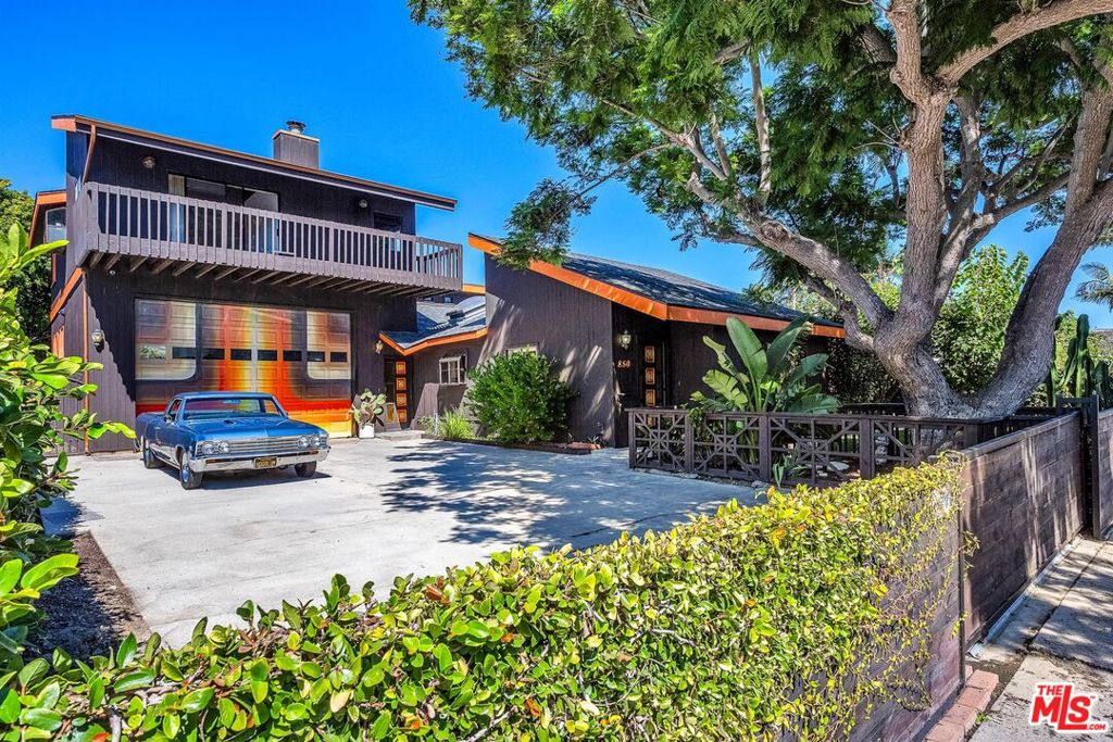 Don't miss this spacious, architecturally versatile residence (2,508sq.ft.) on a 6,514sq.ft. lot that offers 3 bedrooms and 3 baths. Built in 1951, this property blends traditional living with exceptional flexibility, ideal for modern beach community lifestyles Ground level: Two bedrooms, two full baths, living room, and a generously sized kitchen. Upper Level Living Space and Garage: The upstairs space could be used as a sumptuous primary suite featuring its own bathroom, fireplace, balcony(s), and a separate family room with kitchenette ideal for multi-generational living, in law arrangement, or private retreat. Garage, Exterior & Lot: An expansive oversized 6 car garage with soaring ceilings that can be used for a home business or art studio. A generously sized lot with a gated driveway with room for a large RV or Boat, just minutes away from the Cabrillo launch ramp. A rare find in this coastal enclave. Enjoy the fresh ocean air! Located just a minutes from waterfront parks, trails, and neighborhood gathering points, this home invites the quintessential San Pedro beach community lifestyle. The proximity to the Port of Los Angeles, local eateries, and annual community events fosters a tight-knit, authentic coastal neighborhood vibe.