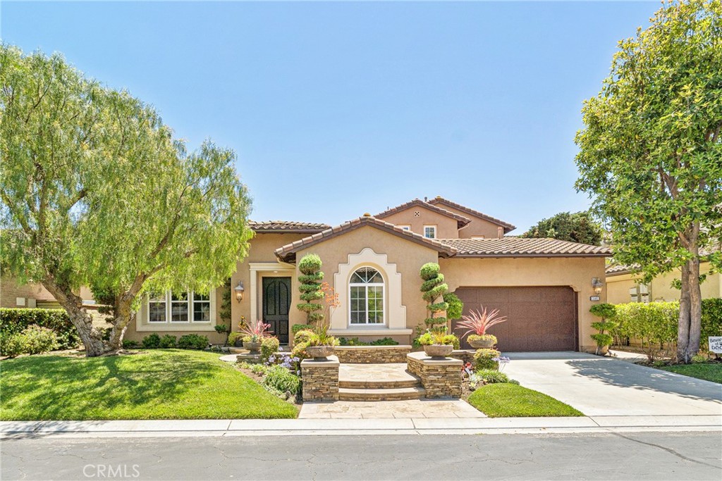 Discover refined living in the exclusive gated community of Rancho Madrina in historic San Juan Capistrano. This beautifully designed 4-bedroom, 3.5-bath residence offers the perfect blend of comfort, elegance, and functionality. Step into the inviting formal living room, complete with a cozy gas fireplace and adjacent bonus room — ideal as a home office, game room, or an additional main-floor bedroom. A spacious formal dining room connects seamlessly to the gourmet kitchen via a convenient butler’s pantry. Designed with the chef in mind, the kitchen features a gas cooktop, granite countertops, large center island, and breakfast nook that opens to the expansive family room and backyard. Enjoy California's indoor-outdoor lifestyle with a charming center atrium, accessible from both the dining and family rooms. The main-floor primary suite offers a peaceful retreat with direct access to the pool and spa. It includes a dedicated office space and a spa-inspired bathroom with a walk-in shower, soaking tub, and generous walk-in closet. Upstairs, you'll find three additional bedrooms, a viewing balcony, and a spacious loft overlooking the backyard—perfect for relaxing or movie nights. The backyard is an entertainer’s dream with a built-in BBQ station and a resort-style pool and spa, ideal for gatherings or quiet relaxation. Located just minutes from historic downtown San Juan Capistrano and surrounded by scenic hiking trails, this elegant home offers the ultimate Southern California lifestyle. Don’t miss this rare lease opportunity in Rancho Madrina—schedule your private showing today!