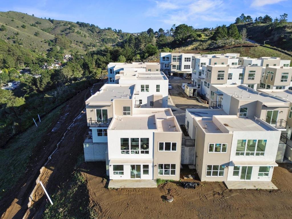 Welcome to Pacifica Heights - Where Luxury meets Serenity! Each residence has been meticulously designed with modern architecture, spacious layouts, and energy-efficient features, ensuring a comfortable and environmentally responsible lifestyle. 833 Fassler: A ground floor bedroom with en-suite bathroom. This floorplan incorporates modern convenience with seamless flow. On the main level, you will find a large living area that blends with the open kitchen. The kitchen features a large island with a sink and pantry area. The dining area is situated directly off the kitchen and leads you to a sprawling patio perfect for enjoying the coastal breeze. Upstairs you will find two additional bedrooms including a large primary suite. Primary bedroom incorporates space for a seating / lounge area and attached bathroom. Primary bath features double vanities, freestanding tub, and separate shower. Additional en-suite bath with shower over tub, serving the other two bedroom. The powder room on the main level is perfect for guests and convenience. Additional features include an upstairs in-unit laundry room, ample storage space, and attached two car garage. This is now Pacifica's finest address!