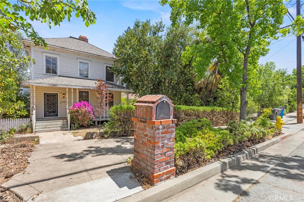 Step back in time with all the comforts of modern living in this beautifully maintained early 1900s Victorian gem. This charming 2-story home blends historic character with thoughtful updates and sits on a spacious 0.23-acre lot. With 2,752 square feet of living space, this 3-bedroom, 3.5-bath residence offers timeless appeal and functional living across two primary suites—perfect for multi-generational living or hosting guests in style. From the moment you arrive, the home's distinctive Victorian architecture and covered front porch welcome you with warmth and elegance. Inside, you'll discover high ceilings, intricate built-in features, and classic details that showcase the home’s vintage charm. The cozy fireplace with pellet stove insert anchors the living room, providing ambiance and warmth during cooler months. One of the standout features of this home is the upstairs primary suite, a private retreat that includes a classic clawfoot bathtub, a walk-in shower, a spacious walk-in closet, and direct access to a rooftop deck—an ideal space for morning coffee or evening relaxation under the stars. The kitchen offers plenty of counter space, complemented by a wet bar—ideal for entertaining. A bonus room provides flexibility for a home office, playroom, or additional living area. Ceiling fans and central heat & air ensure comfort year-round. Enjoy your time outdoors in the beautifully landscaped yard, complete with brick walkways, mature trees, and a whimsical dollhouse tucked away for imaginative play or charming garden storage. The yard is fenced and cross-fenced for privacy, and the property includes a detached garage, under-house storage, and a separate storage shed for all your needs. This home is more than just a place to live—it’s a lifestyle. Located close to bike trails, lakes, rivers, shopping, dining, and a wide range of outdoor activities, you’ll enjoy the convenience of town with the peacefulness of a quiet, established neighborhood. Whether you're drawn to the historic charm, the unique layout with dual primary suites, or the inviting outdoor spaces, this home offers a rare opportunity to own a piece of the past—without sacrificing modern conveniences. Don't miss your chance to fall in love with this one-of-a-kind Victorian treasure!