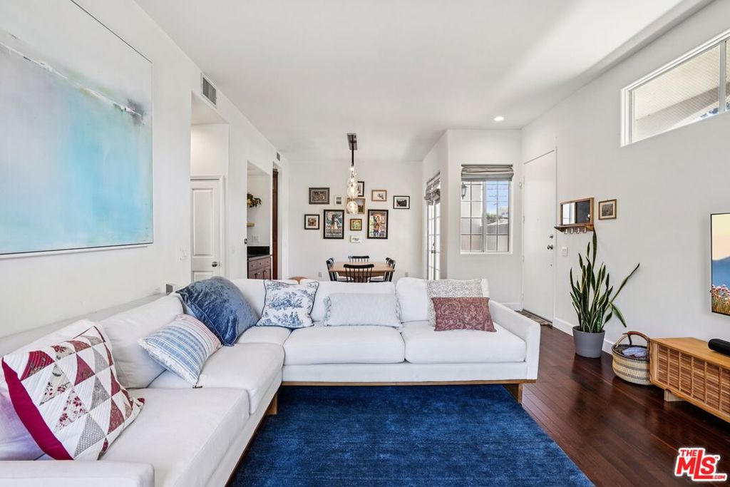A sophisticated and Serene West Los Angeles townhome tucked away in one of the area's most desirable residential pockets. This bright and beautifully maintained end-unit townhouse for sale in Los Angeles offers exceptional privacy and the feel of a single-family home. Featuring a private, direct-access two-car garage and multiple outdoor spaces including a secluded patio and a sun-drenched balcony this home is designed for both relaxed living and effortless entertaining. Inside, you'll find an airy, open-concept floor plan with rich hardwood floors, a cozy fireplace, and separate areas for formal dining and casual meals. The spacious chef's kitchen flows seamlessly into the main living area, creating an ideal setting for gatherings and daily life. Upstairs, the expansive primary suite impresses with soaring ceilings, a statement fireplace, a walk-in closet, and direct access to a private balcony - a peaceful retreat in the heart of the city. Two additional bedrooms, a second full bathroom, and an in-unit laundry area complete the upper level. Set in a prime West LA location, this townhome offers unbeatable access to top-rated Sawtelle restaurants, cafes, local shops, and major freeways. Just a short drive or bike ride to Santa Monica, Brentwood, and the best beaches in Los Angeles, this home delivers a rare blend of comfort, modern style, and urban convenience. If you're searching for a move-in ready townhouse in West Los Angeles, look no further this is the one that truly feels like home.
