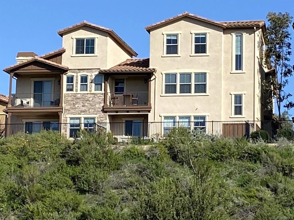 Escape to serenity in Del Sur with this exceptional townhome uniquely situated on the Canyon Ridge with panoramic Mountain and Sunset Views. Lives like a single family home tucked into a quiet motor courtyard with an attached 2 car garage. Updated with high end finishes incl. new paint, luxury plank vinyl flooring and shiplap accents for a modern, coastal farmhouse feel. 3 blocks to Del Sur Elementary and close to all the shops and restaurants in Del Sur Town Center and 4S Commons. A rare opportunity to own on the canyon ridge in Del Sur! First time on the market. This townhome sets the others apart, situated on a center canyon lot, with exquisite mountain and sunset views offering privacy in the backyard and primary bedroom balcony. Recently updated with luxury plank vinyl flooring, stylish shiplap with a versatile floorplan that features 3 bedrooms plus an additional loft also overlooking the canyon and perfect for a home office, gym or guest suite. The spacious primary bedroom offers spectacular views, tranquil balcony, large bath and walk in closet. Beyond the serene setting this location offers unparalleled walkability to top tier community amenities including 11 pools and parks. Everyday conveniences are just moments away with the Del Sur Town Center and 4S Commons offering a variety of shopping and dining options. You will not want to miss this one!