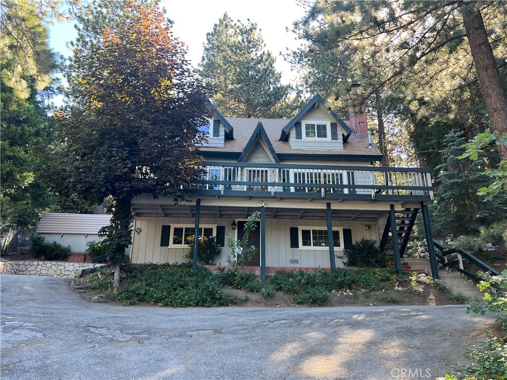 This adorable mountain home has 3 bedrooms and 2 baths, nestled on 18,000 sq ft of lush surroundings. The entry has a covered porch perfect during those winter months. A den with built in shelving and cabinets welcome you as you enter. The laundry, workshop and storage room are in a separate room to the right of entering. The second level brings you into a gourmet kitchen with beautiful cabinets and granite countertops, open to the dining area and living room with fireplace make for a perfect family gathering. Enjoy the front deck off the living room on those cool summer evenings. A bedroom and bathroom make up this main level. The third level has two large bedrooms with vaulted ceilings and jack and jill bathroom. Tankless water heater, newer dual pane windows, hot tub, 2-storage sheds and large fenced back yard are just some of the added features. This lush setting has endless gardening opportunities. Minutes to the local ski resort, hiking trails and town with restaurants and shopping make this an ideal vacation getaway or a full time paradise in the making!