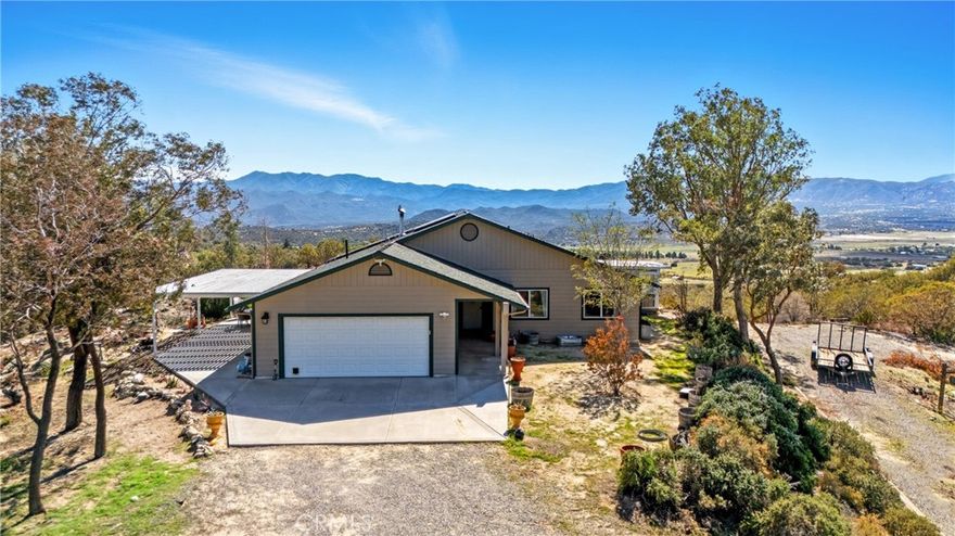 Versatile Anza Property on 4.66 Acres! Self-Sufficient Living with Income Potential with this 2,487 sq ft home! Discover the perfect blend of comfort, functionality, and opportunity with this beautiful 3-bedroom, 2.5-bathroom home on 4.66 acres in scenic Anza. Complete with an attached casita with a separate entrance, this property is ideal for multi-generational living, guest accommodations, or rental income. Designed for off-grid peace of mind, the property features a private well, solar power, and a backup generator to keep utility costs low and systems running year-round. A covered, cemented patio offers the perfect space for relaxing or entertaining while taking in breathtaking mountain views. Equestrian and gardening enthusiasts will love the horse facilities and greenhouse, while an automated gated entry ensures privacy and convenience. Located within walking distance to the Pacific Crest Trail, this property offers a unique business opportunity to host hikers with the casita, ample space, and peaceful surroundings, it’s a ready-made retreat. 30 minutes from Wine Country and 40 minutes to Palm Springs. Come see it!
