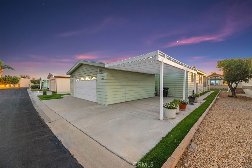 FHA and VA financing available! Welcome to Eastlake, a vibrant 55+ community where you own the land. This beautiful home offers over 1,800 square feet with 3 bedrooms and 2 bathrooms, providing ample space and comfort. The primary suite features a private bathroom with dual sinks, a walk-in shower, and a walk-in closet. The property also includes a convenient oversized two-car garage, driveway for an additional vehicle, and a low-maintenance yard with artificial turf. As a resident, you’ll enjoy amenities designed for an active lifestyle. Take a dip in the sparkling pool, relax in the spa, challenge friends to a game of tennis or pickleball, or enjoy billiards. Golf enthusiasts will love having a course just across the street. Eastlake offers a warm, welcoming atmosphere perfect for those young at heart seeking both recreation and social connection. Don’t miss your chance to make this exceptional home yours. Move right in and start enjoying all that Eastlake has to offer. Schedule your showing today!