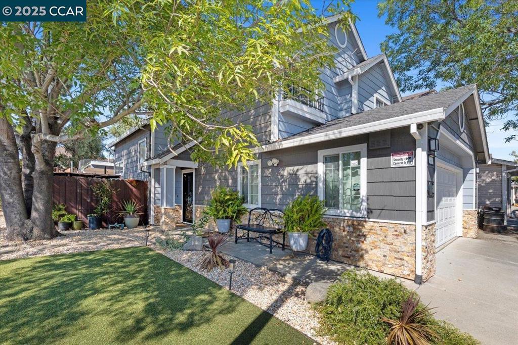 Unlock this contemporary 3-bedroom home with a BONUS room. This beautifully home offers modern living with a versatile bonus room perfect for an office, guest space, or gym. The contemporary exterior is enhanced by elegant stone accents and stylish landscaping, including low-maintenance turf and mature trees. The inviting front patio and backyard access make entertaining effortless. With its clean lines, open spaces, and thoughtful design, this home blends comfort and sophistication in every detail.