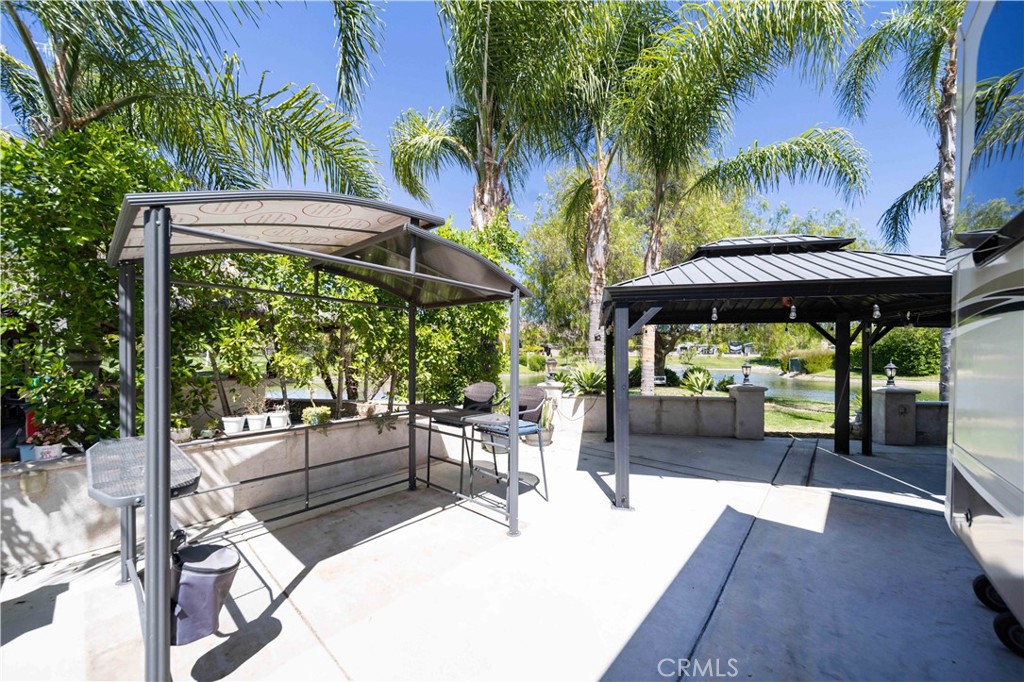 Water Front Lot with three gazebos inside gated Golf Course community of Rancho California RV Resort. This place has everything; Club House, Tennis Courts, Pickle Ball Courts, Horse Shoe Lawn, Dog Park, Fishing Lake, Unlimited Golf on 14 hole Executive course, Fitness Room, Library, Laundry facilities, 5 pool and Jacuzzi areas, Hiking and Riding Trails, and Restaurant all inside 24 hour gated community. You can live here, or rent your space. Just think of it; Peace and quite serenity all just 25 minutes from Temecula Wine Country. No age restriction. This lot is #428 Durango close to the Club House and Pool. It is 81X40 with Extended Concrete and Privacy Wall at the front with a spot for your Golf Cart. It is backed to one of several Beautiful Ponds on the Golf Course. The Ginormous Tree provides shade and picturesque area for relaxing with a cocktail in hand. Financing Available...