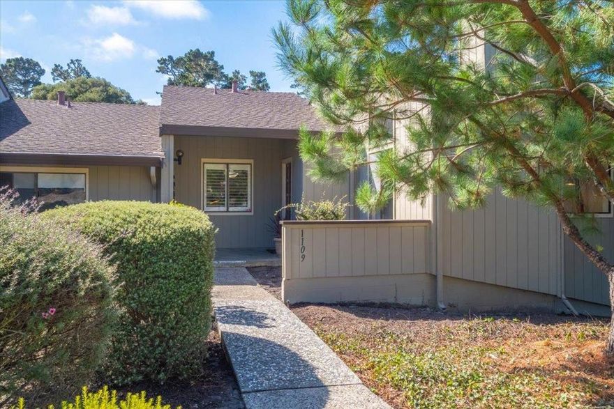 Welcome to this almost sgl level (only 2 steps inside) contemporary home in picturesque PG!  Offering 1,167 sf, this condo offers 2 bedrooms and 2 full bathrooms--both with timeless updated features.  A washer and dryer are included hidden in the guest bathroom.  The kitchen is equipped with modern amenities, featuring solid surface Quartz countertops, gorgeous easy close cherry cabinets, a farmhouse sink and hi-end stainless appliances--a delightful space for culinary enthusiasts. The kitchen features a pass thru opening to the spacious dining area. The open beam/high ceiling design adds character to the living spaces, complemented by brand new engineered wood-like flooring throughout. Cozy up next to the fireplace during cooler evenings. There is a welcoming patio for sunny afternoons and bbqing and an oversize detached  2 car garage in back--pull into the garage with your groceries, walk through the patio into the kitchen--easy one level.