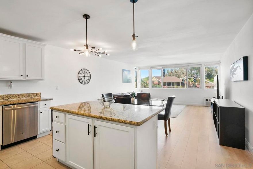 Welcome to 4501 Collwood Blvd Unit 4, a move-in-ready condo nestled in the heart of San Diego's vibrant 92115 neighborhood. This charming 2-bedroom, 2-bathroom home offers the perfect blend of classic character and modern convenience. This building permits Short Term Rentals, making it an excellent opportunity for both investors and owner-users.   Come inside and be greeted by a bright, spacious open floor plan that flows effortlessly. The kitchen has been thoughtfully updated with sleek countertops, modern cabinetry, and integrated appliances, making it a joy to cook and entertain in. The large living and dining areas are bathed in natural light, providing a warm and inviting atmosphere.  Both bedrooms are generously sized and offer plenty of storage, with the master suite serving as a peaceful retreat complete with a private en-suite bathroom. An in-unit washer and dryer combo adds an extra layer of convenience.  Outside, the community provides a serene escape, and you'll enjoy the added bonus of two assigned parking spaces.  Situated between the desirable neighborhoods of Talmadge and College West, this home puts you in the center of it all. You'll be just minutes from San Diego State University and have quick access to major freeways, making your commute and weekend adventures a breeze.  This is more than a home; it's a lifestyle. Explore the eclectic dining, trendy cafes, and vibrant parks that define this dynamic community.  Ready to see your new​​‌​​​​‌​​‌‌​​‌​​​‌‌​​​‌​​‌‌​​​‌​‌​​​‌‌​ home?