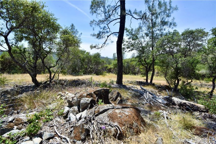 Oroville, California – 19.47 Acres Near Lake Oroville

Tucked away at the end of Mackey Court, this 19.47-acre parcel offers privacy, natural beauty, and excellent potential for your future retreat or homestead.

Location & Landscape:

Enjoy an end-of-the-road setting with seclusion and peace. The land is mostly level and fenced with access gates making it easier to develop, and is accented by open meadows, scattered digger pines, and striking rock outcroppings.

Scenic Views:

From the west, take in partial valley views, while to the east, mountain vistas frame the horizon—perfect for soaking in Oroville’s serene surroundings.

Fencing & Fire Safety:

The property is mostly fenced with clearly flagged corners for easy identification. Importantly, it escaped recent wildfires and benefited from the Forbestown Ridge Project Cooperative Agreement with Cal Fire in 2019. This program thinned dense brush and overstocked trees, reducing fire risk, creating a healthier forest, and opening up even more spectacular views.

Utilities:

PG&E power runs along Mackey Court, right to the cul-de-sac entrance of the property, offering straightforward access to electricity when you’re ready to build.

Road & Access:

A private dirt road/jeep trail begins at the cul-de-sac and runs through the property to its far boundary, providing excellent internal access for exploring, building, or recreation.

Recreation & Nearby Amenities:

Just a short drive to Lake Oroville and the Feather River Recreation Area, this location is perfect for boating, fishing, hiking, or simply enjoying the mountain air. Whether you’re dreaming of a cabin, a personal getaway, or just a place to escape the bustle of town, this property offers endless opportunities.

The Bottom Line:

With nearly 20 acres of usable land, panoramic views, fire safety improvements, and utilities nearby, this clean and desirable parcel is an outstanding opportunity to own your own slice of the Oroville foothills.