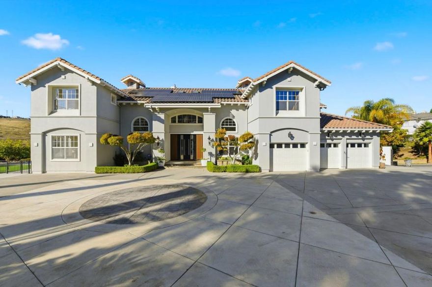 Discover exceptional modern luxury in this exquisite executive estate, perfectly situated in the prestigious Silvercreek neighborhood. Completely renovated with a sleek contemporary design and high-end finishes throughout, this 4,948-square-foot residence sits on a generous 1.2-acre lot. The home offers 6 bedrooms, a private study, 5.5 beautifully appointed bathrooms, and a 3-car garage. Energy efficiency meets elegance with 21kW of owned solar panels under NEM 2, keeping utility costs impressively low. The expansive living and dining areas feature soaring ceilings and a grand open layout that radiates style and comfort. The gourmet kitchen boasts a large central island, built-in Thermador cooktop, refrigerator and freezer, and premium Miele oven and microwave ideal for both everyday living and entertaining. The luxurious primary suite includes a private sitting area, spa-inspired bath with a freestanding soaking tub, dual vanities, and generous walk-in closet. A truly rare opportunity to own a residence that embodies the very best of modern design, comfort, and sophistication.