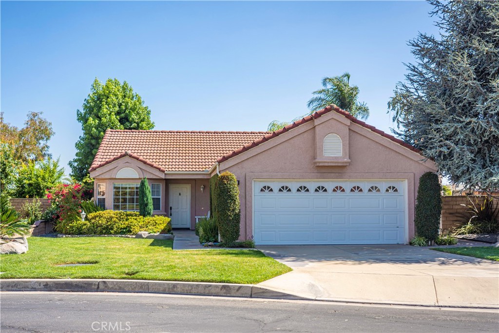 Nestled on a cul-de-sac in one of Upland’s desirable neighborhoods, this beautiful professionally landscaped single-story home is the perfect blend of style, comfort, and convenience. With 3 spacious bedrooms, 2 bathrooms, and an inviting open floor plan, this home offers everything you need to create lasting memories. Step inside to find a bright, welcoming living room with a cozy fireplace that flows effortlessly into the dining area, where sliding glass doors open to the backyard perfect for indoor-outdoor entertaining. The remodeled kitchen features sleek quartz countertops, a breakfast nook, and modern finishes designed for both everyday living and gourmet cooking. The primary suite is a private retreat, featuring mirrored closet doors, a stylish ¾ bathroom, and direct access to the backyard for peaceful morning coffee or evening relaxation. A full hall bathroom, individual laundry room, and a 2-car attached garage with direct home access add convenience and functionality. Enjoy the spacious backyard, complete with a covered patio ideal for BBQs and gatherings. The community association offers resort-style amenities including a pool, spa, tennis courts, and a playground. Additional features include dual-pane windows, central AC, and abundant natural light throughout. Located close to top-rated schools, beautiful parks, and shopping destinations, this home truly offers the best of both lifestyle and location. Don’t miss this turnkey gem!