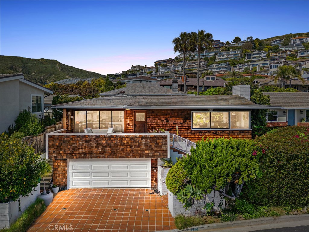 Live in Emerald Bay—Laguna Beach’s most exclusive gated beachside community. This rare opportunity offers the perfect canvas to build your family's custom dream home in a location that embodies privacy, prestige, and panoramic ocean views.
Situated on one of the most tranquil and child-friendly one-way streets in the community, the property boasts a desirable orientation that captures coastal breezes and sunlight throughout the day. The existing 3-bedroom, 3-bathroom home provides comfortable living with multiple private outdoor spaces—all showcasing views of the Pacific. However, the true value lies in the long-term potential to rebuild and create a legacy home tailored to your vision.
Emerald Bay is more than just a neighborhood—it’s a lifestyle. As a resident, you’ll enjoy access to a private white sand beach, an oceanfront pool complex, six tennis courts, sand volleyball, basketball courts, a clubhouse, lush parks, and year-round community events and children's programs. The Mediterranean-style charm and unmatched security of this gated enclave offer a sense of tranquility rarely found on the California coast.
Just a short stroll from Palm Tree Circle and moments away from Laguna Beach’s world-class dining, art galleries, and surf, this is a generational opportunity to create lasting memories and long-term value in one of Southern California’s most sought-after coastal communities.
Emerald Bay is where luxury meets lifestyle—and your dream home awaits.